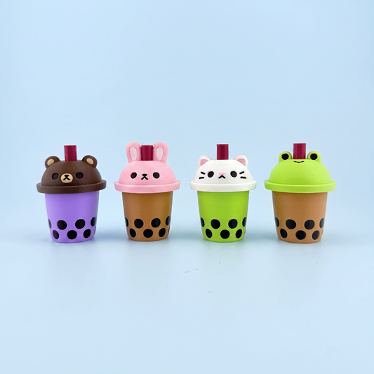 Four 3D printed bubble tea fidget clickers with bear, bunny, cat and frog lids