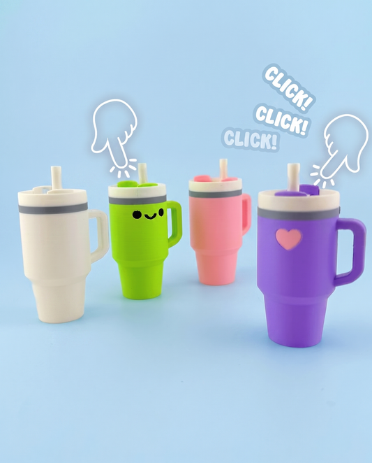 Four tumbler fidget clickers being pressed with a click