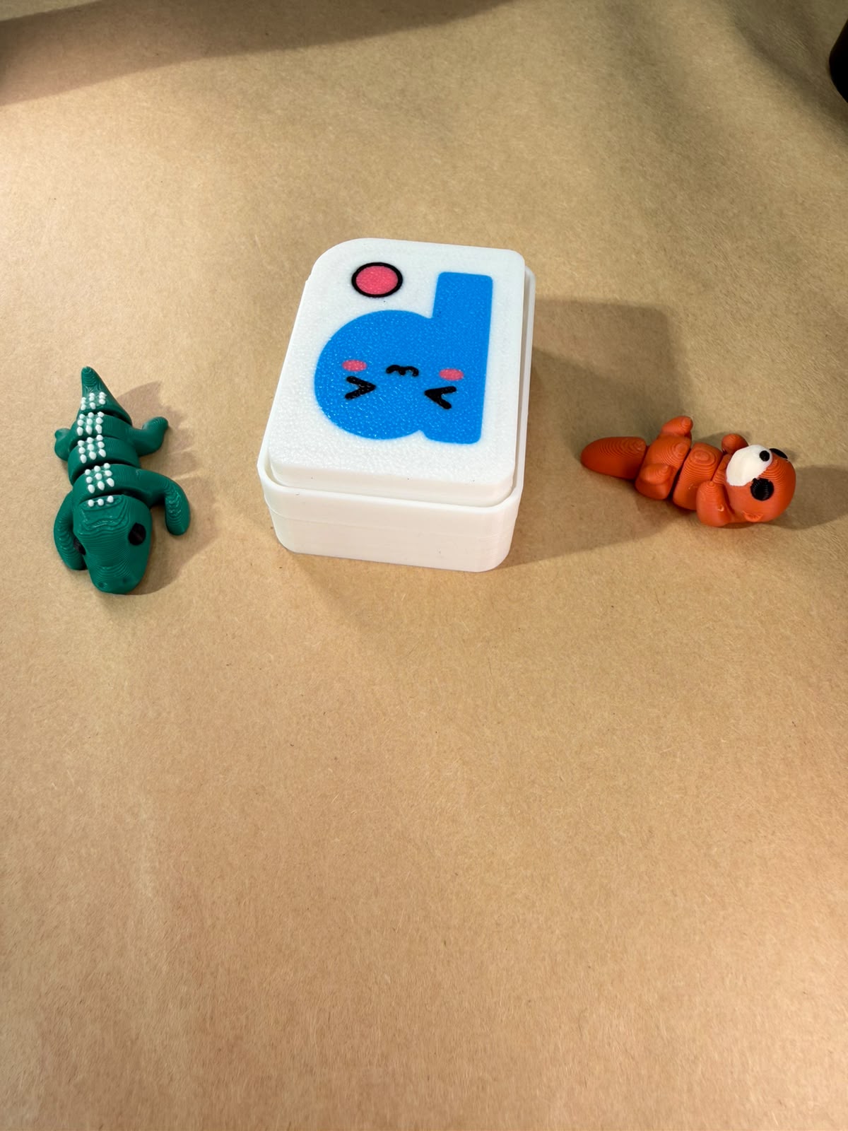 Printies Clicker next to mini Printies flexi figures for scale