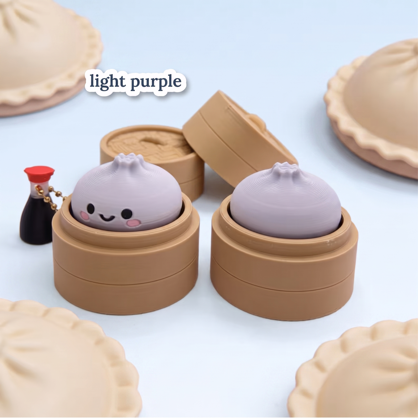 Light purple Dumpling Fidget Clicker keychain in its steamer basket