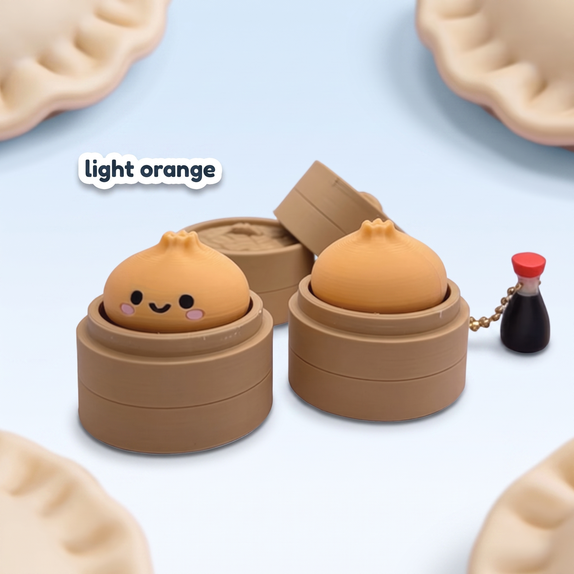 Light orange Dumpling Fidget Clicker keychain in its steamer basket