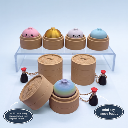 The steamer basket lid turns for a surprise reveal, plus the mini soy sauce charm