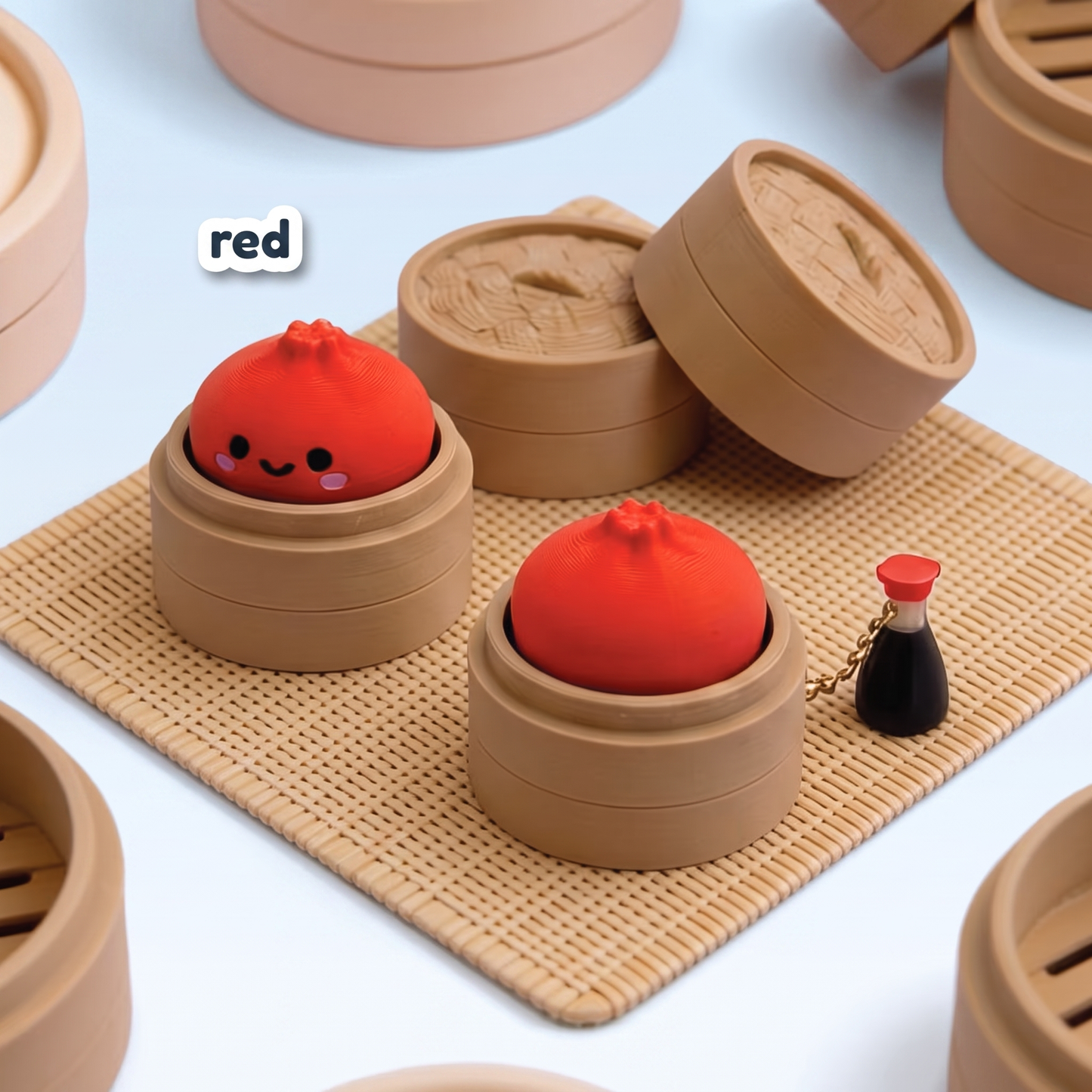 Red Dumpling Fidget Clicker keychain in its steamer basket