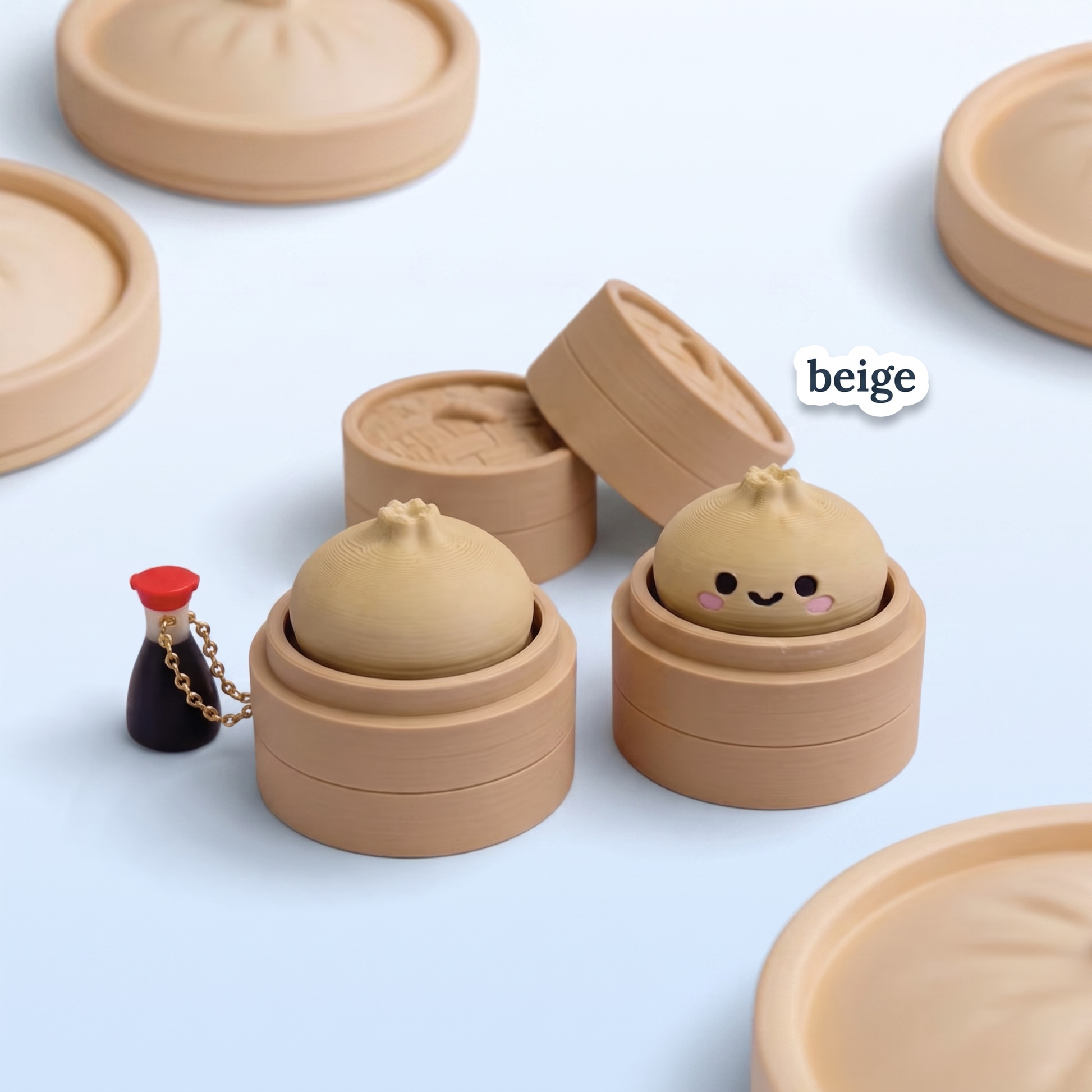 Beige Dumpling Fidget Clicker keychain in its steamer basket