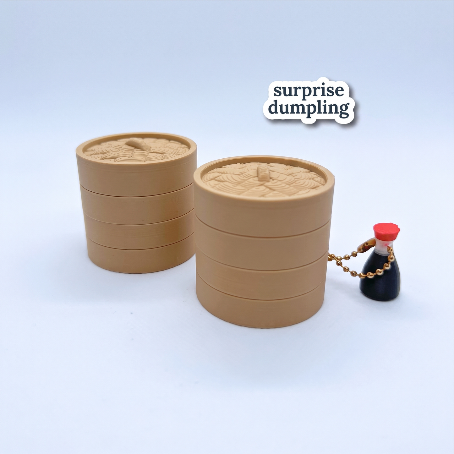Surprise dumpling — the clicker hidden inside its closed steamer basket