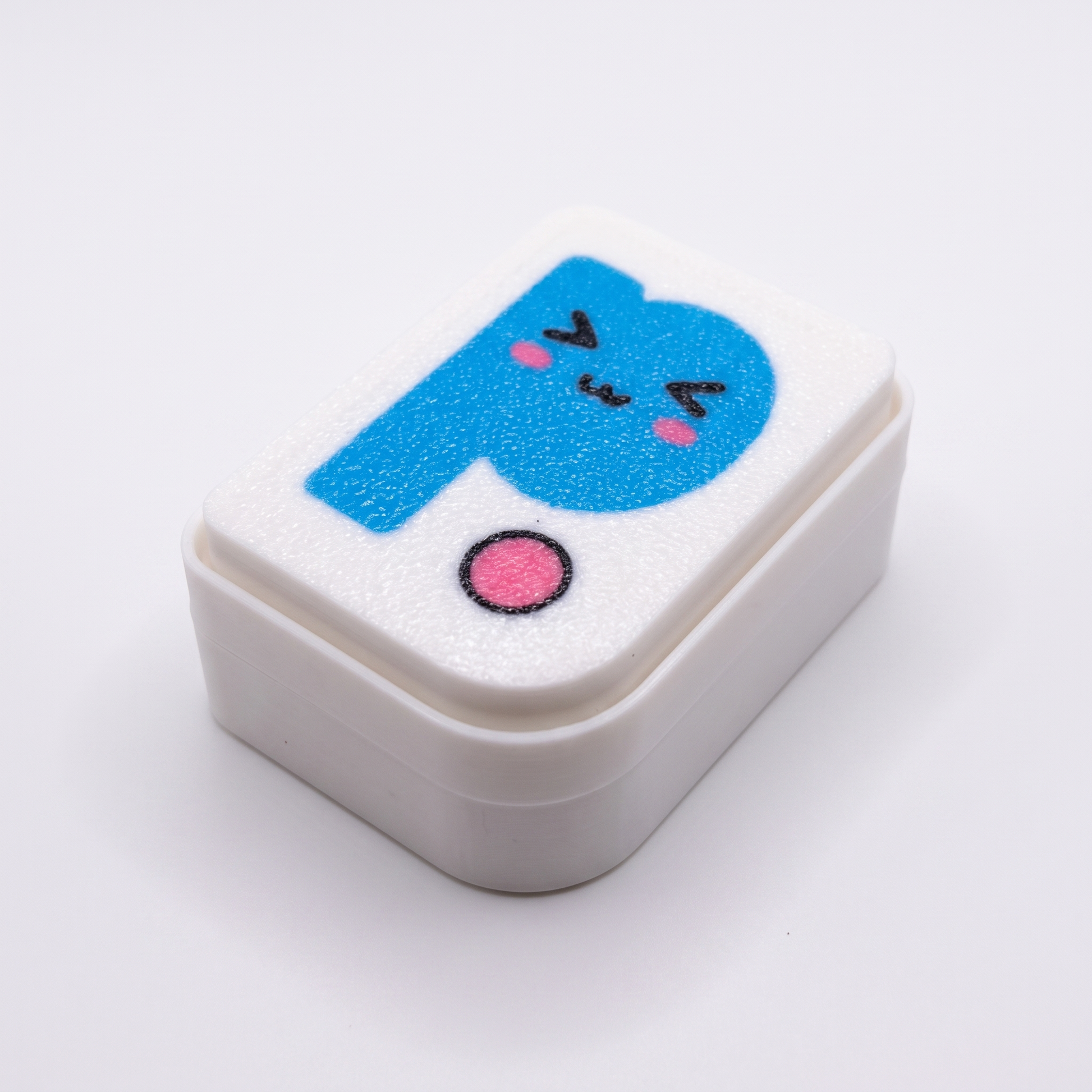 Printies Clicker — white fidget clicker with kawaii Printies P logo top