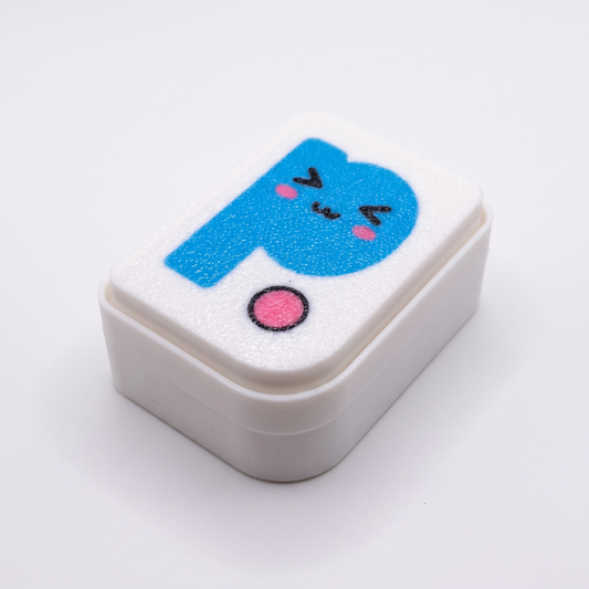 Printies Clicker — white fidget clicker with kawaii Printies P logo top