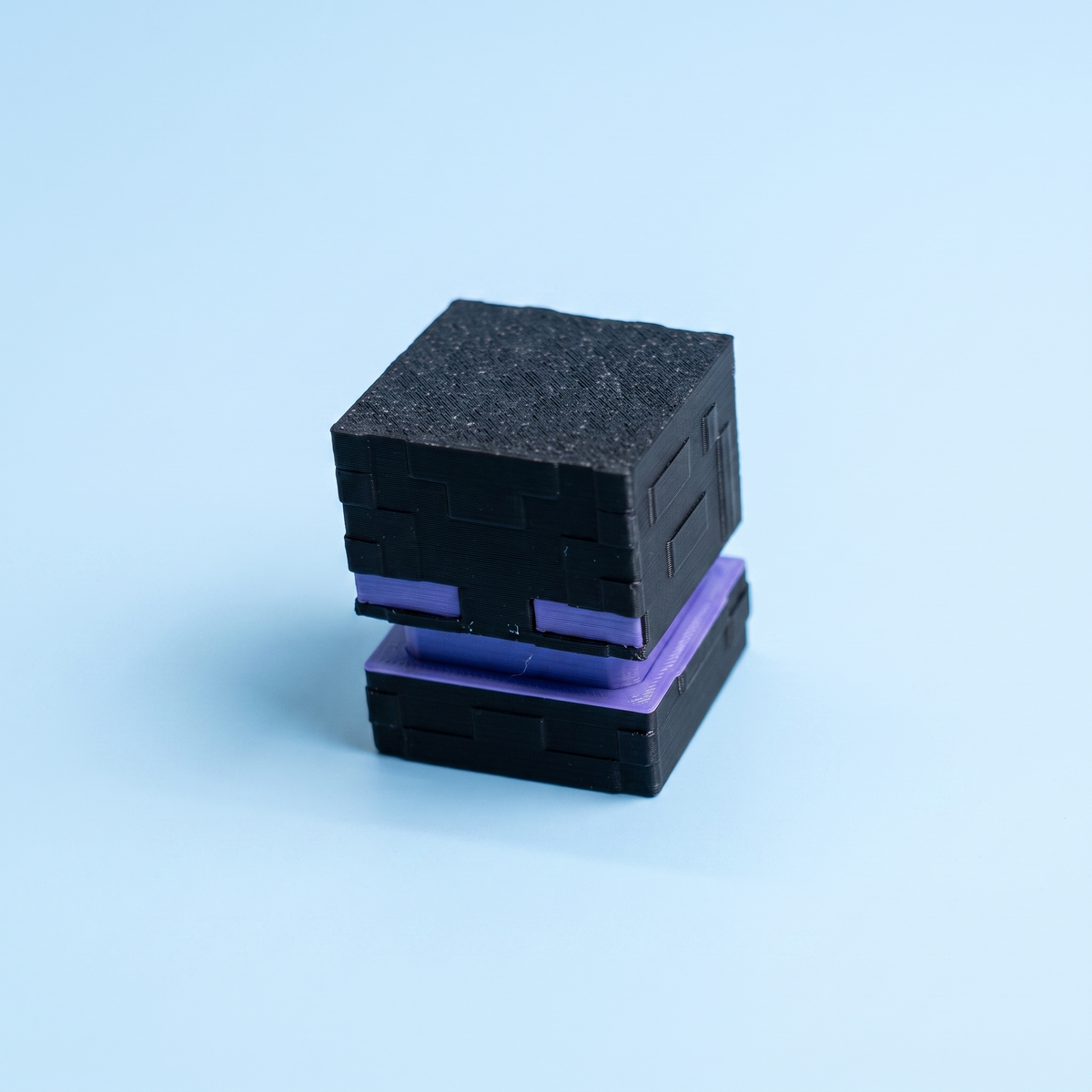 Black enderman fidget clicker with purple eyes and purple base