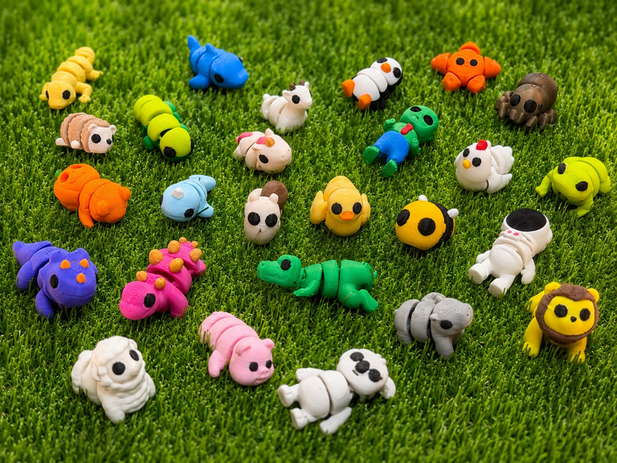 Single figures — the full Mini Printies lineup on grass