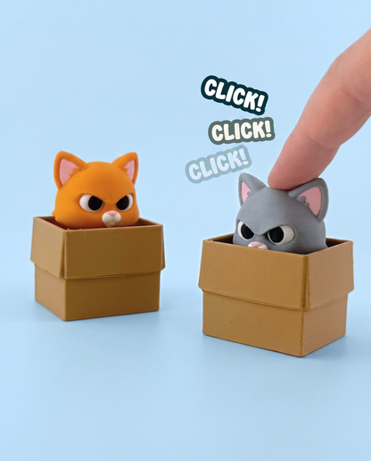 Box Cat fidget clickers being pressed - orange and grey cats in cardboard boxes