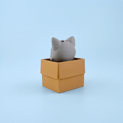Box Cat clicker pressed down into its box