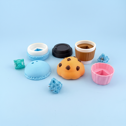 Cafe food clicker parts laid out - printed shells and the mechanical switches inside
