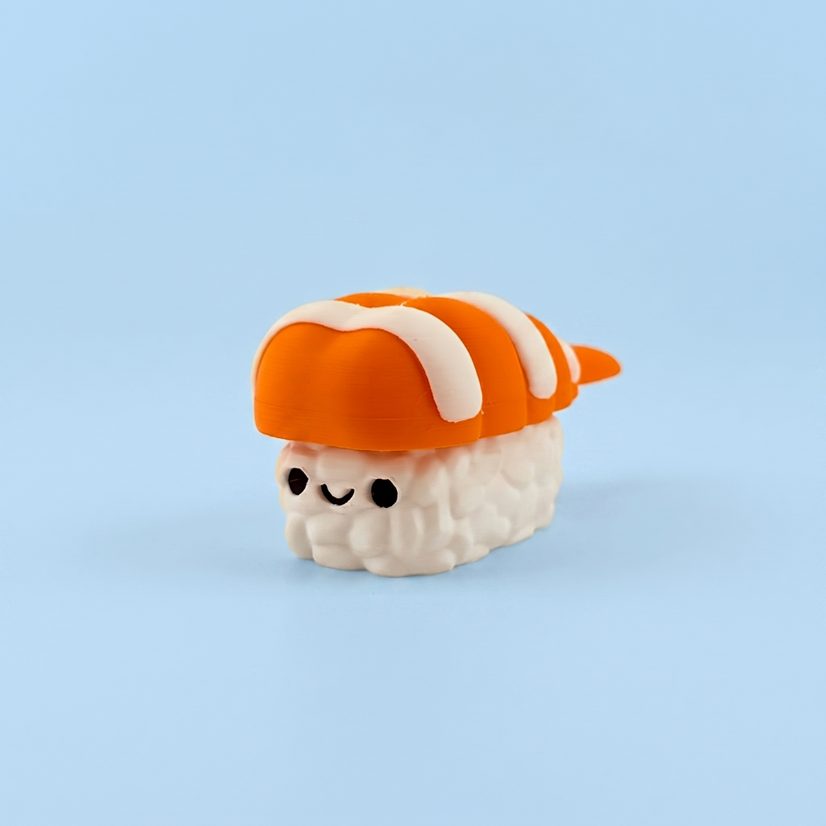 Prawn nigiri fidget clicker with a smiley face
