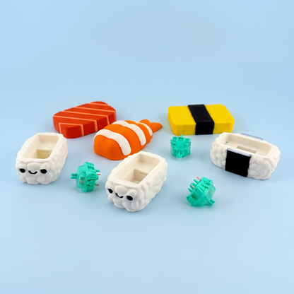 Nigiri clicker parts laid out - printed toppings, rice bases and the mechanical switches inside