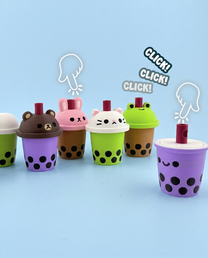 Bubble tea fidget clickers with animal lids being pressed with a click