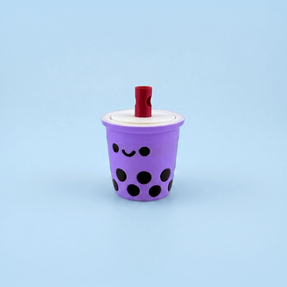Single lilac bubble tea fidget clicker with a smiley face and boba pearls