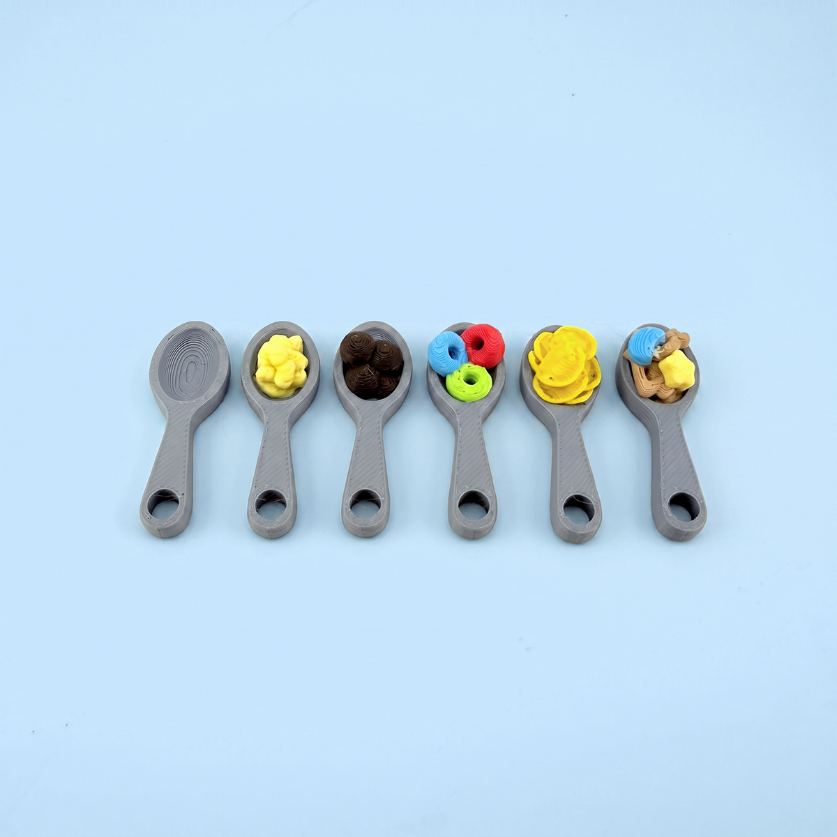 The printed spoons, one for each cereal type