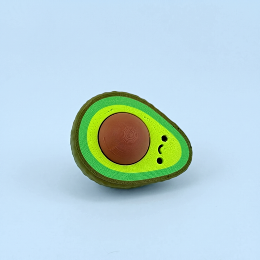 3D printed halved avocado fidget clicker with a pressable stone