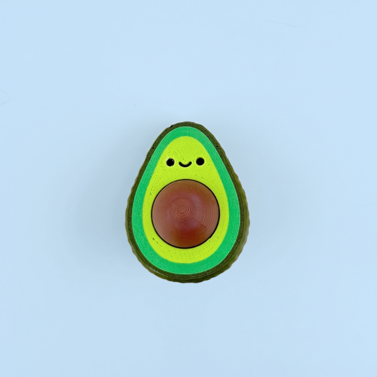Avocado fidget clicker with a smiley face