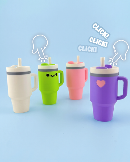 Four tumbler fidget clickers being pressed with a click