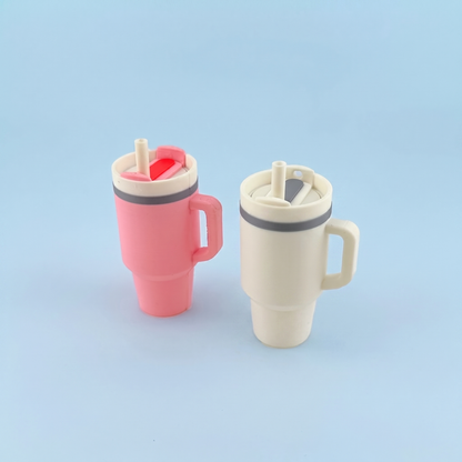 Pink and cream tumbler fidget clickers with flip lids and straws