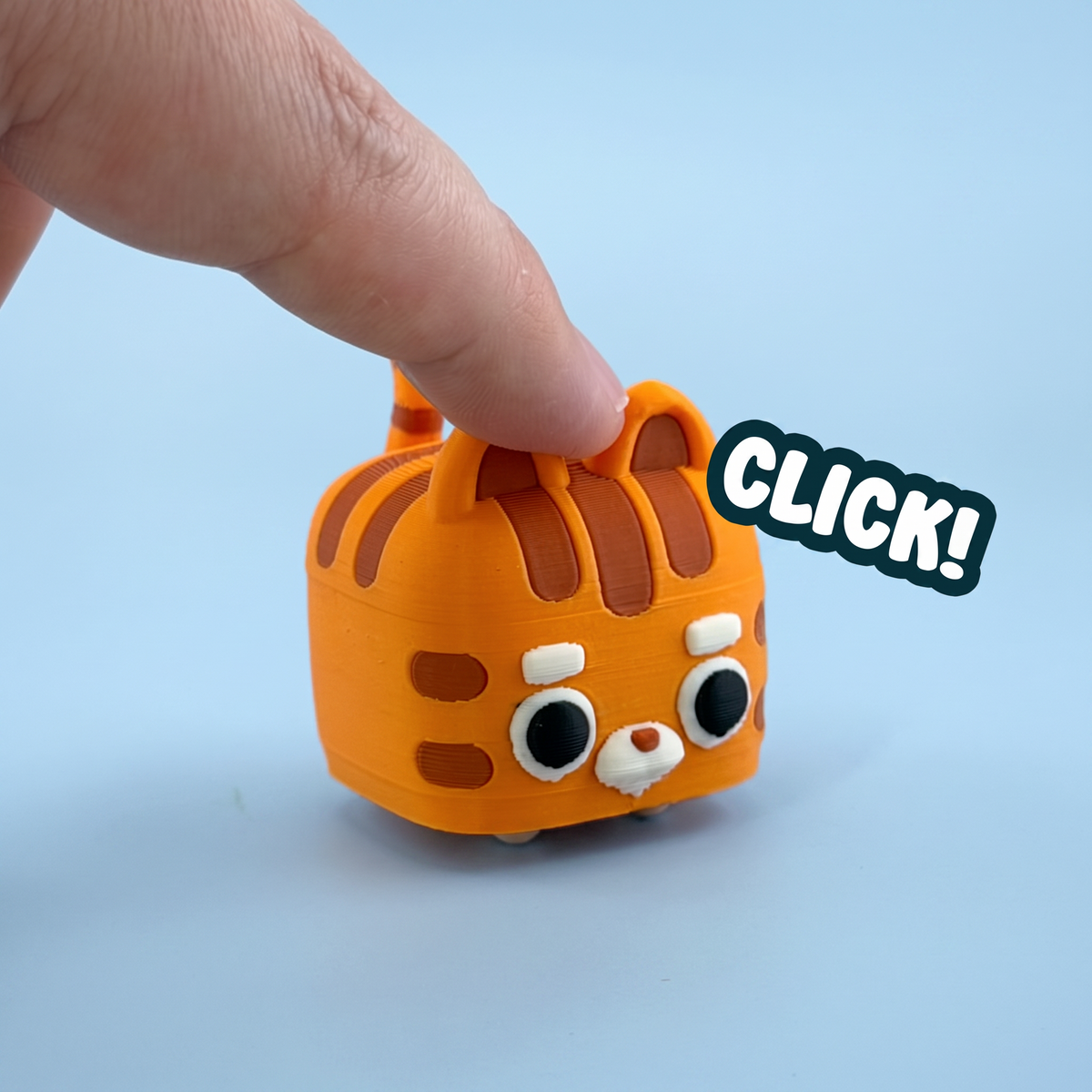 Orange striped cat mini pet fidget clicker being pressed with a click