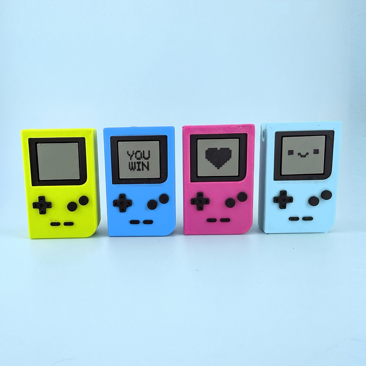 Four pocket console fidget clickers in neon yellow, ocean blue, pink and sky blue